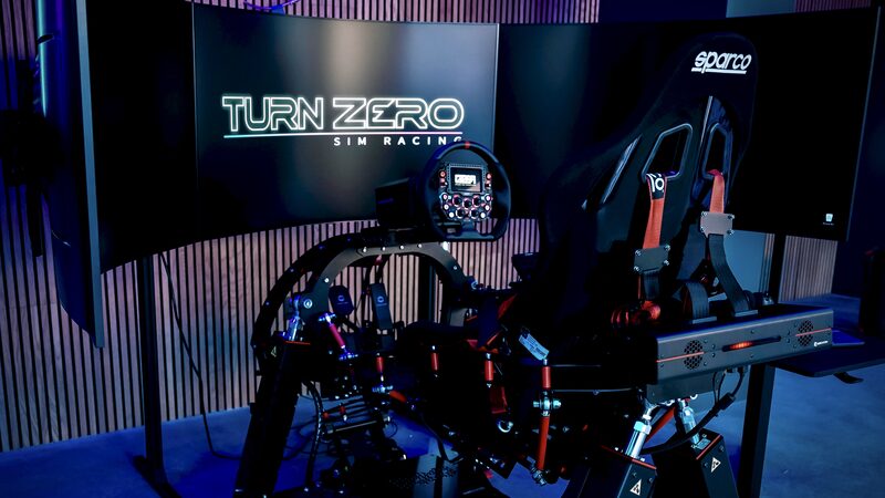 Motion-platform simulator with belt tensioners at the Turn Zero venue