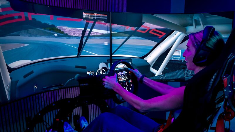 Panoramic triple-screen display wrapping around the cockpit